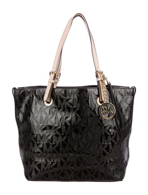 michael kors patent leather tote black|Michael Kors black leather handbag.